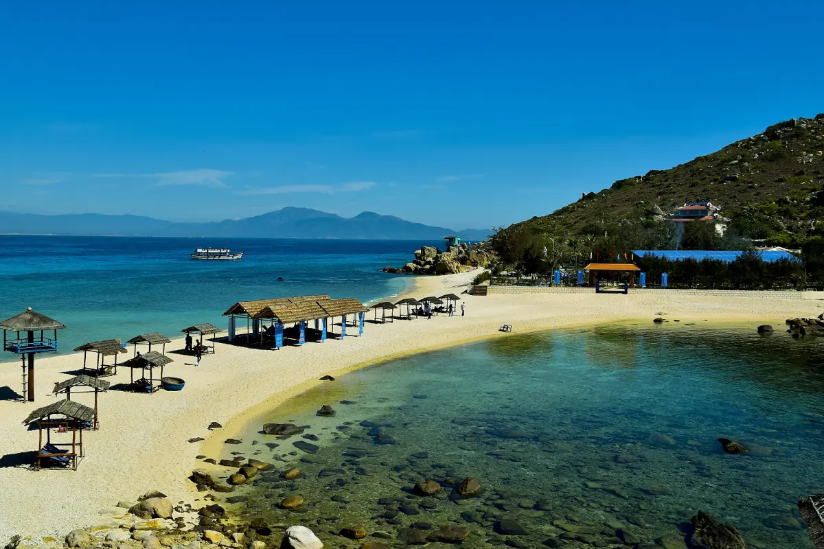 A beach with clear water on an island in Nha Trang Bay